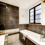 Spacious bathroom with both walk-in shower and bath